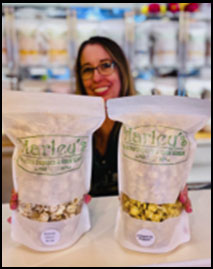 Franchisee with Bags of Harley's Popcorn